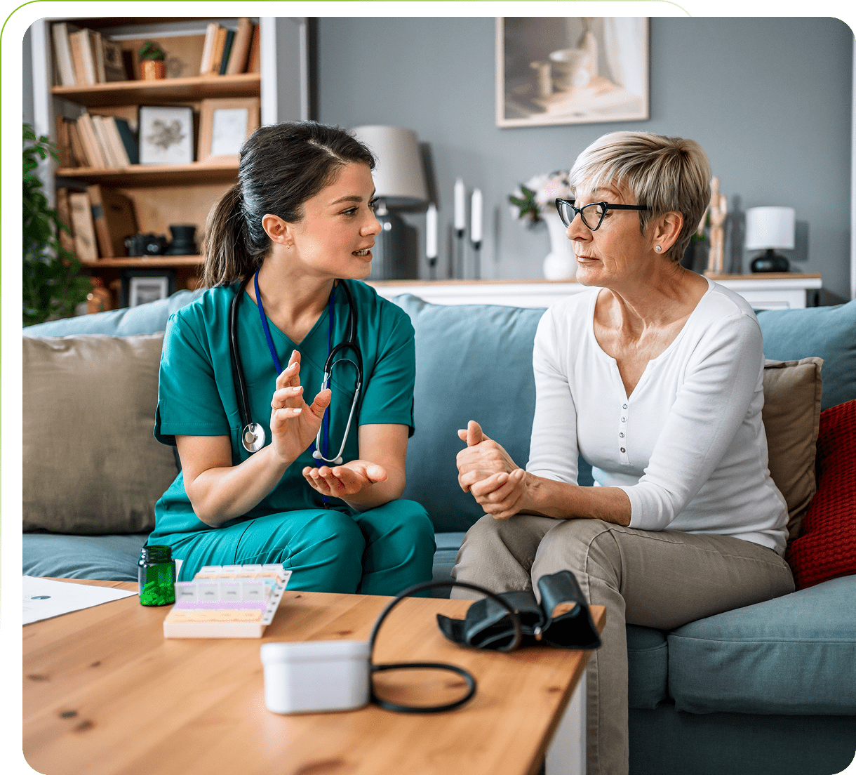Healthcare professional consulting with senior woman.