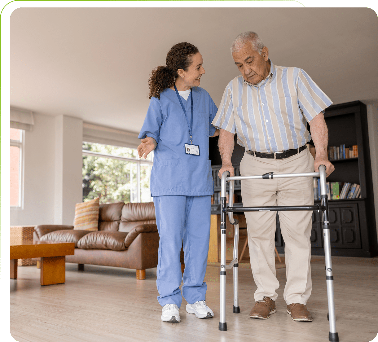 Nurse assisting elderly man with walker indoors.